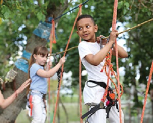 Children playing on a zip line